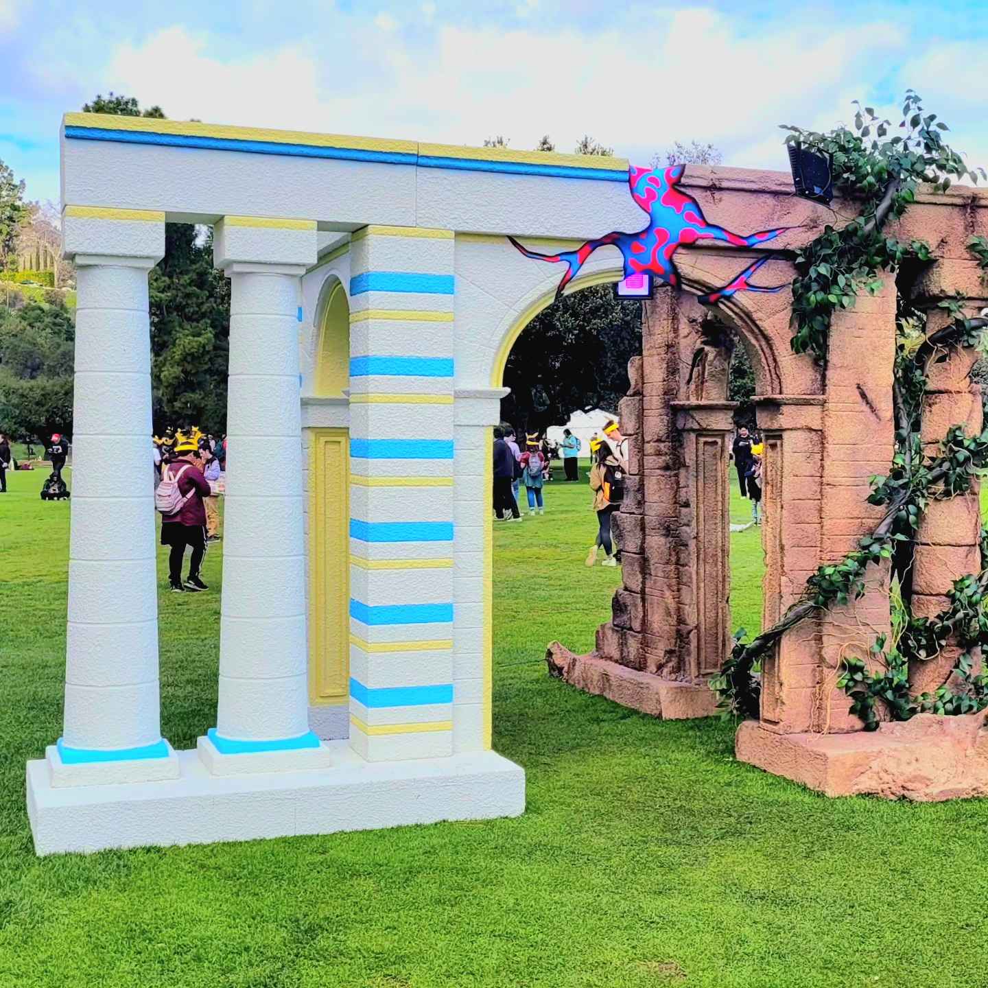 Image of a pillar structure that is half pristine white and half aged brown.